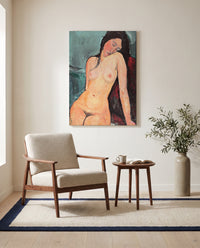 Female Nude by Amedeo Modigliani as a stretched canvas above a linen lounge chair in a reading corner
