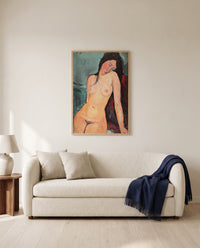 Female Nude by Amedeo Modigliani framed in natural oak above a cream sofa in a warm living room