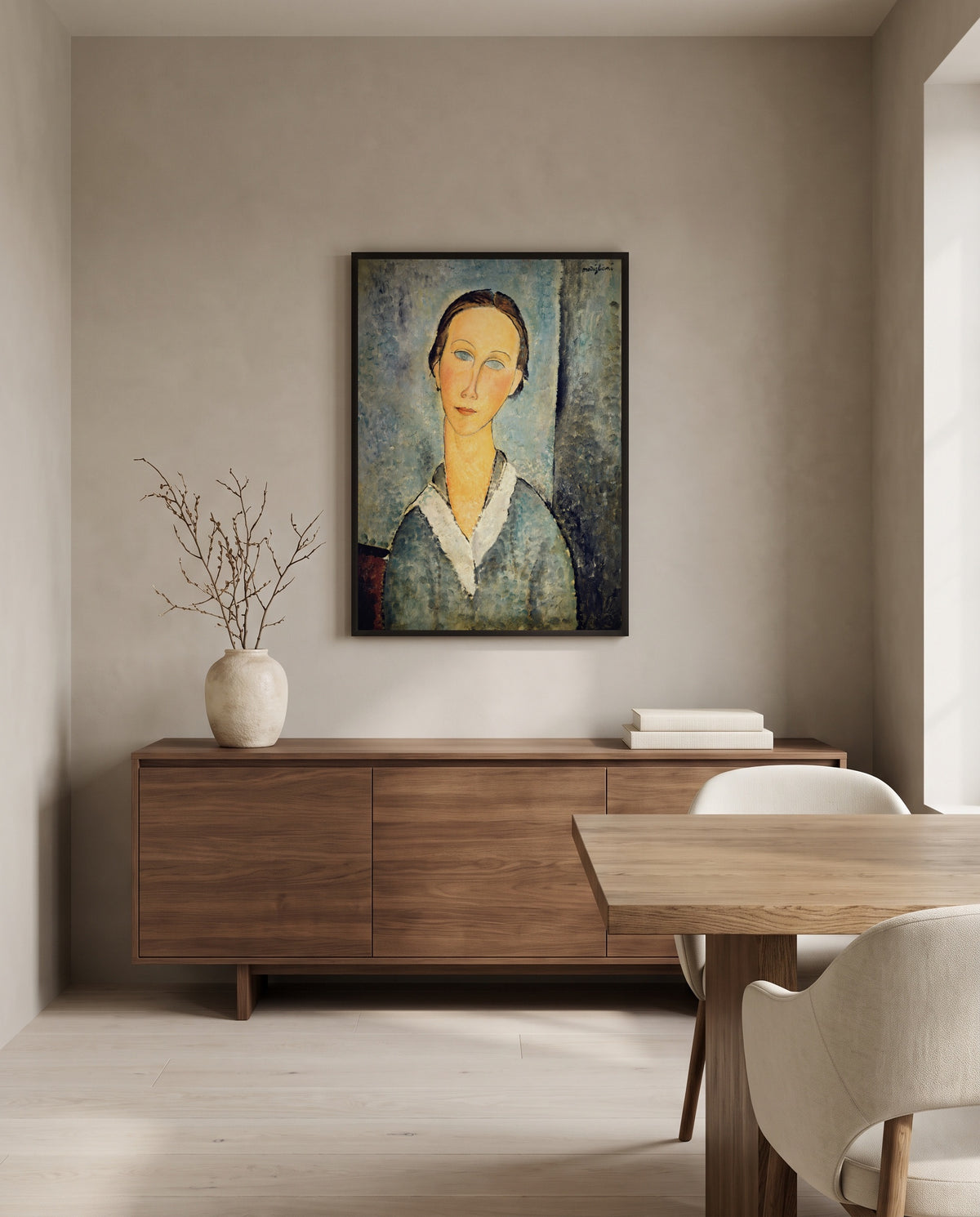 Girl in a Sailor’s Blouse by Amedeo Modigliani in a black frame above a walnut sideboard in a dining room