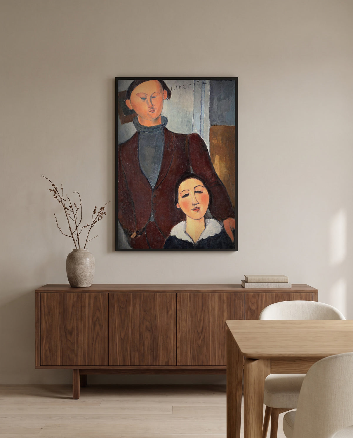 Jacques and Berthe Lipchitz by Amedeo Modigliani in a black frame above a walnut sideboard in a dining room
