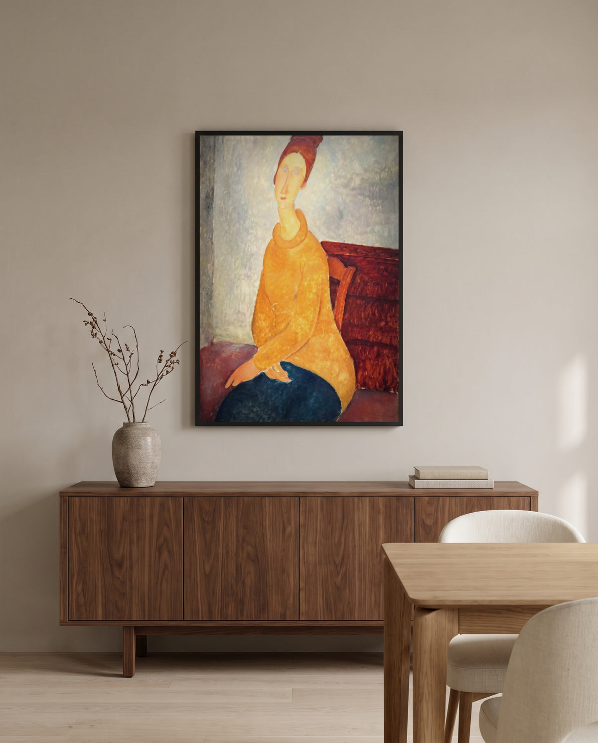 Jeanne in Yellow Sweater by Amedeo Modigliani in a black frame above a walnut sideboard in a dining room