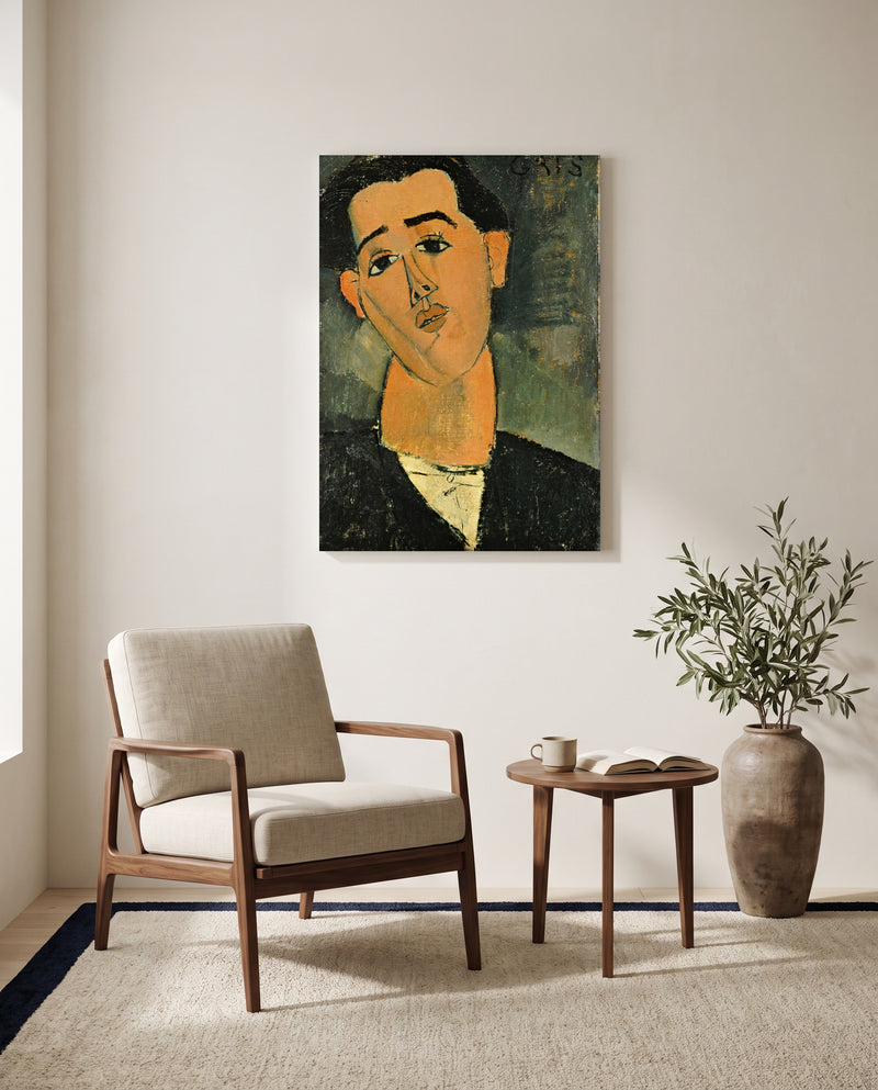 Juan Gris by Amedeo Modigliani as a stretched canvas above a linen lounge chair in a reading corner