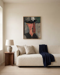 Madam Pompadour by Amedeo Modigliani framed in natural oak above a cream sofa in a warm living room