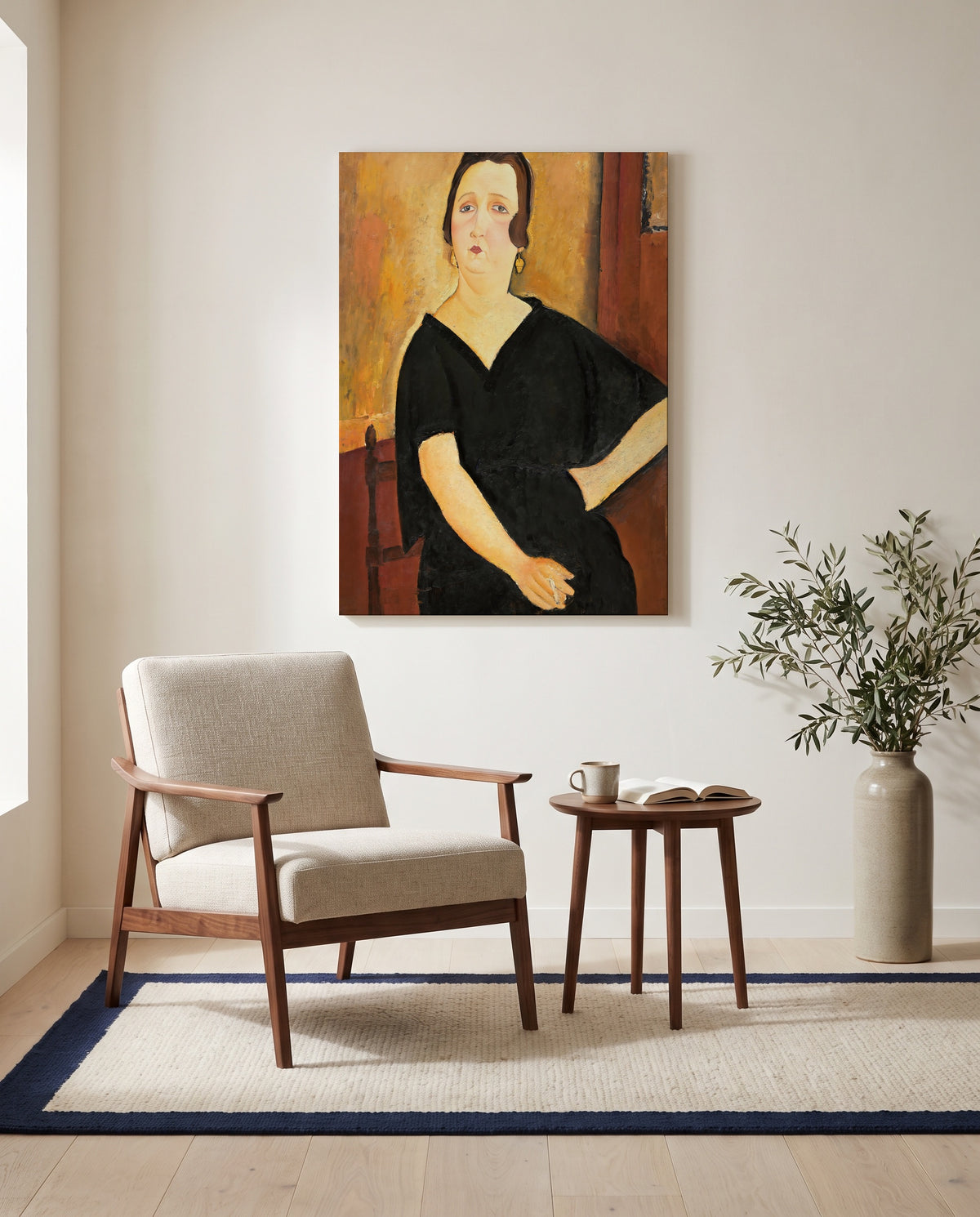 Madame Amédée by Amedeo Modigliani as a stretched canvas above a linen lounge chair in a reading corner