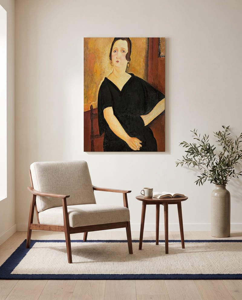 Madame Amédée by Amedeo Modigliani as a stretched canvas above a linen lounge chair in a reading corner