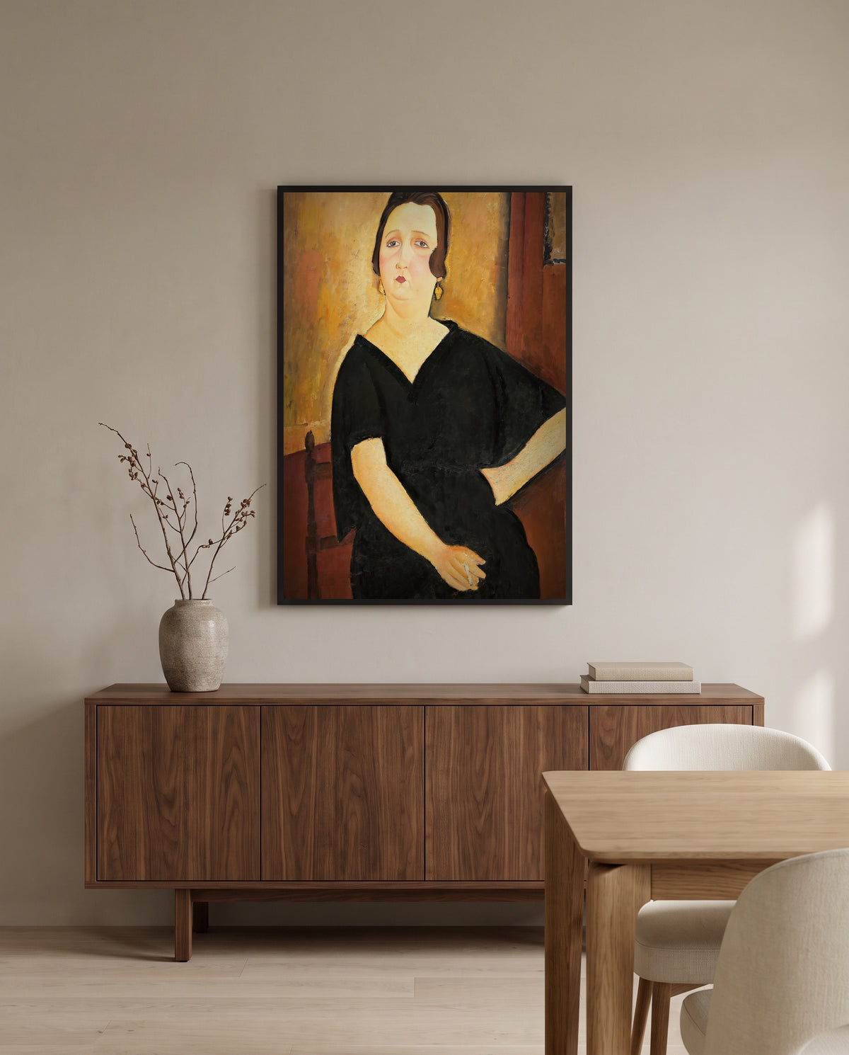 Madame Amédée by Amedeo Modigliani in a black frame above a walnut sideboard in a dining room