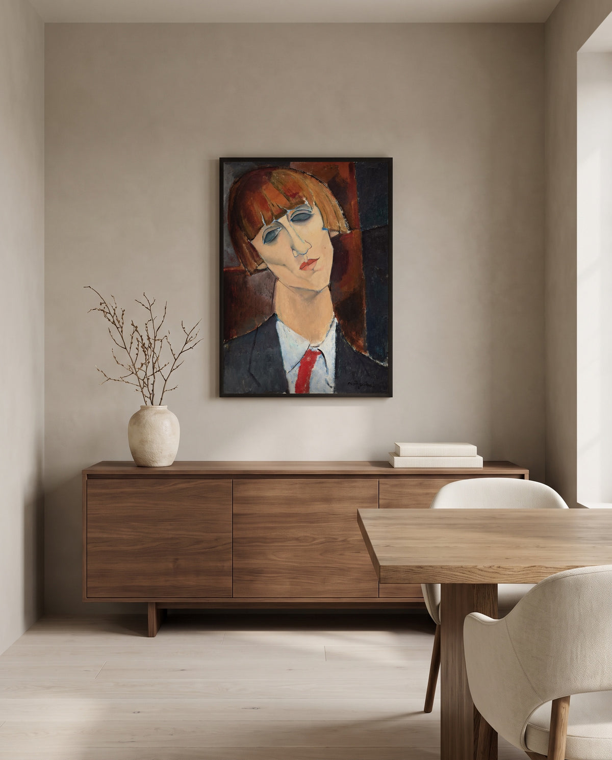 Madame Kisling by Amedeo Modigliani in a black frame above a walnut sideboard in a dining room