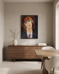 Madame Kisling by Amedeo Modigliani in a black frame above a walnut sideboard in a dining room