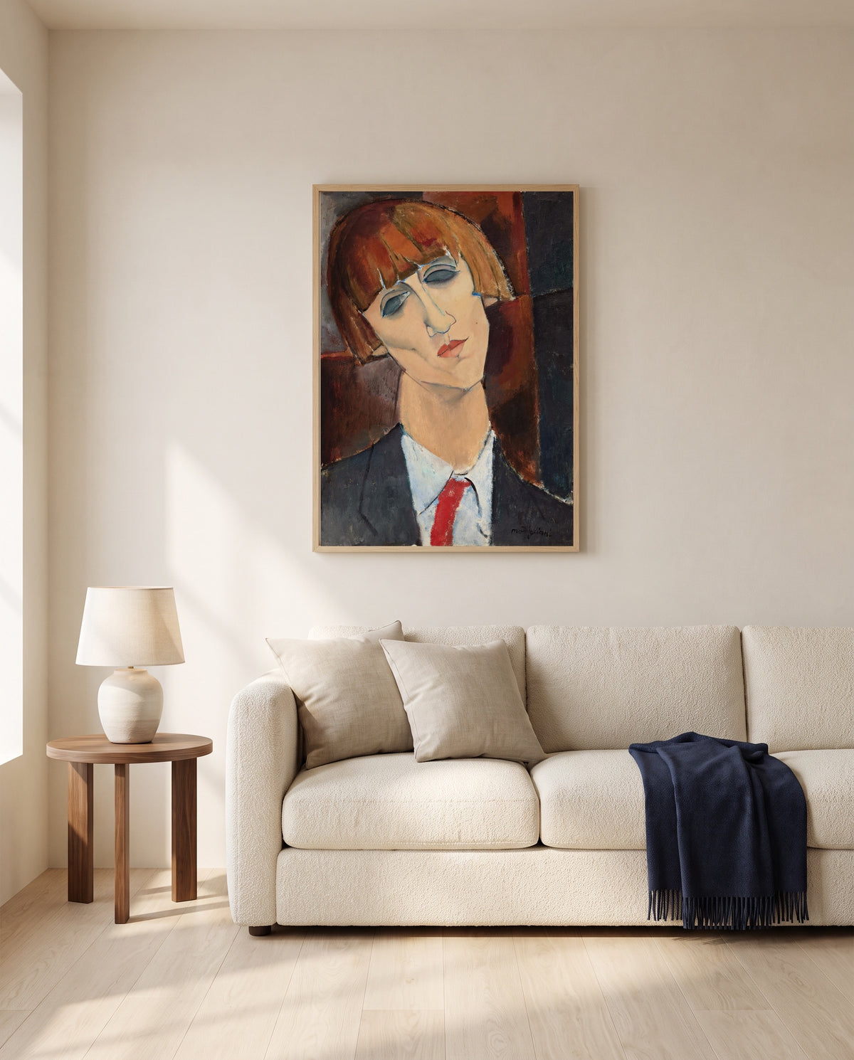 Madame Kisling by Amedeo Modigliani framed in natural oak above a cream sofa in a warm living room