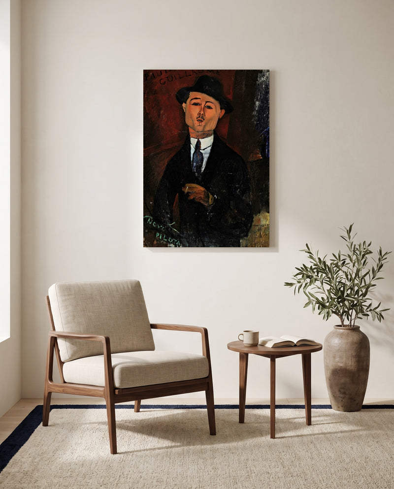 Paul Guillaume, Novo Pilota by Amedeo Modigliani as a stretched canvas above a linen lounge chair in a reading corner