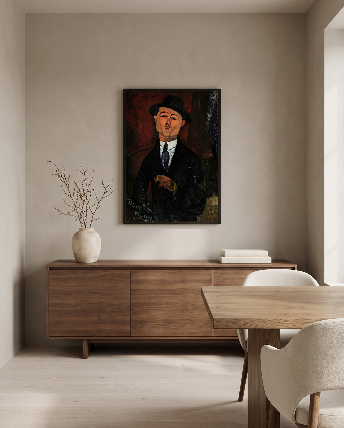 Paul Guillaume, Novo Pilota by Amedeo Modigliani in a black frame above a walnut sideboard in a dining room
