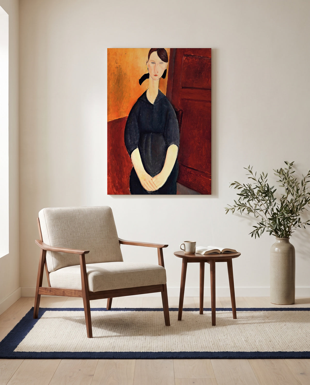 Paulette Jourdain by Amedeo Modigliani as a stretched canvas above a linen lounge chair in a reading corner