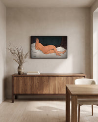 Reclining Nude (Left Side) by Amedeo Modigliani in a black frame above a walnut sideboard in a dining room