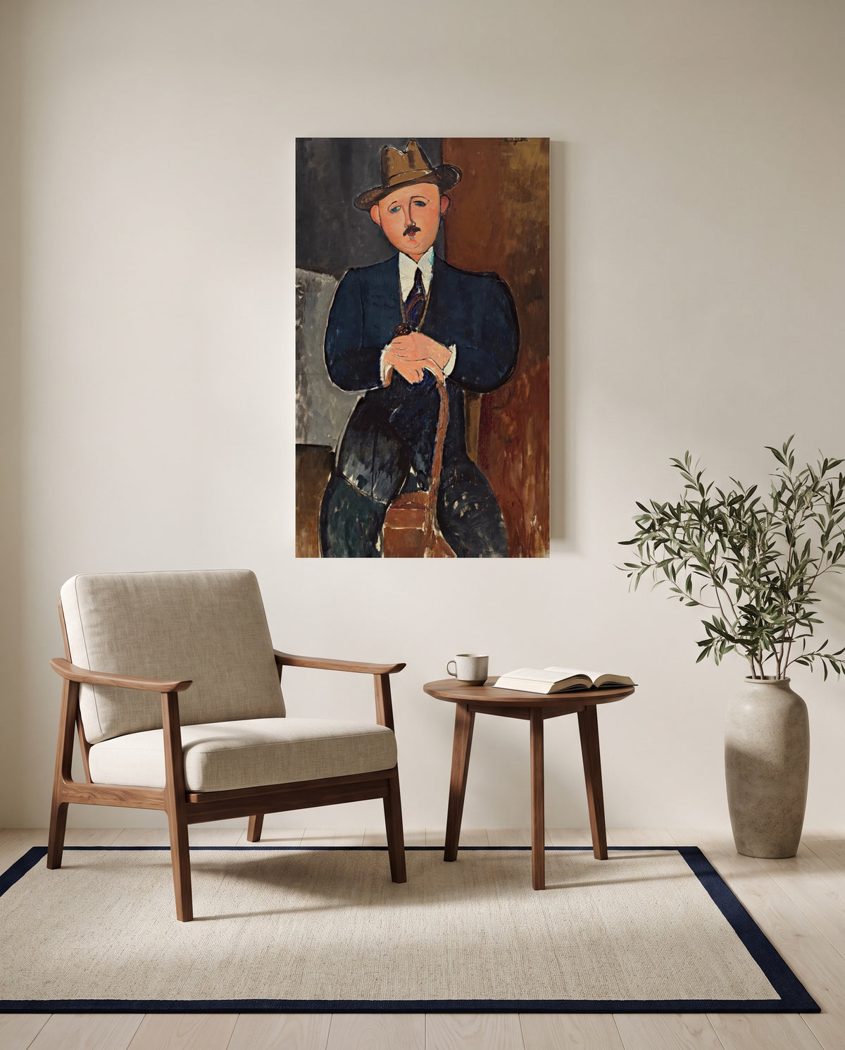 Seated Man with a Cane by Amedeo Modigliani as a stretched canvas above a linen lounge chair in a reading corner