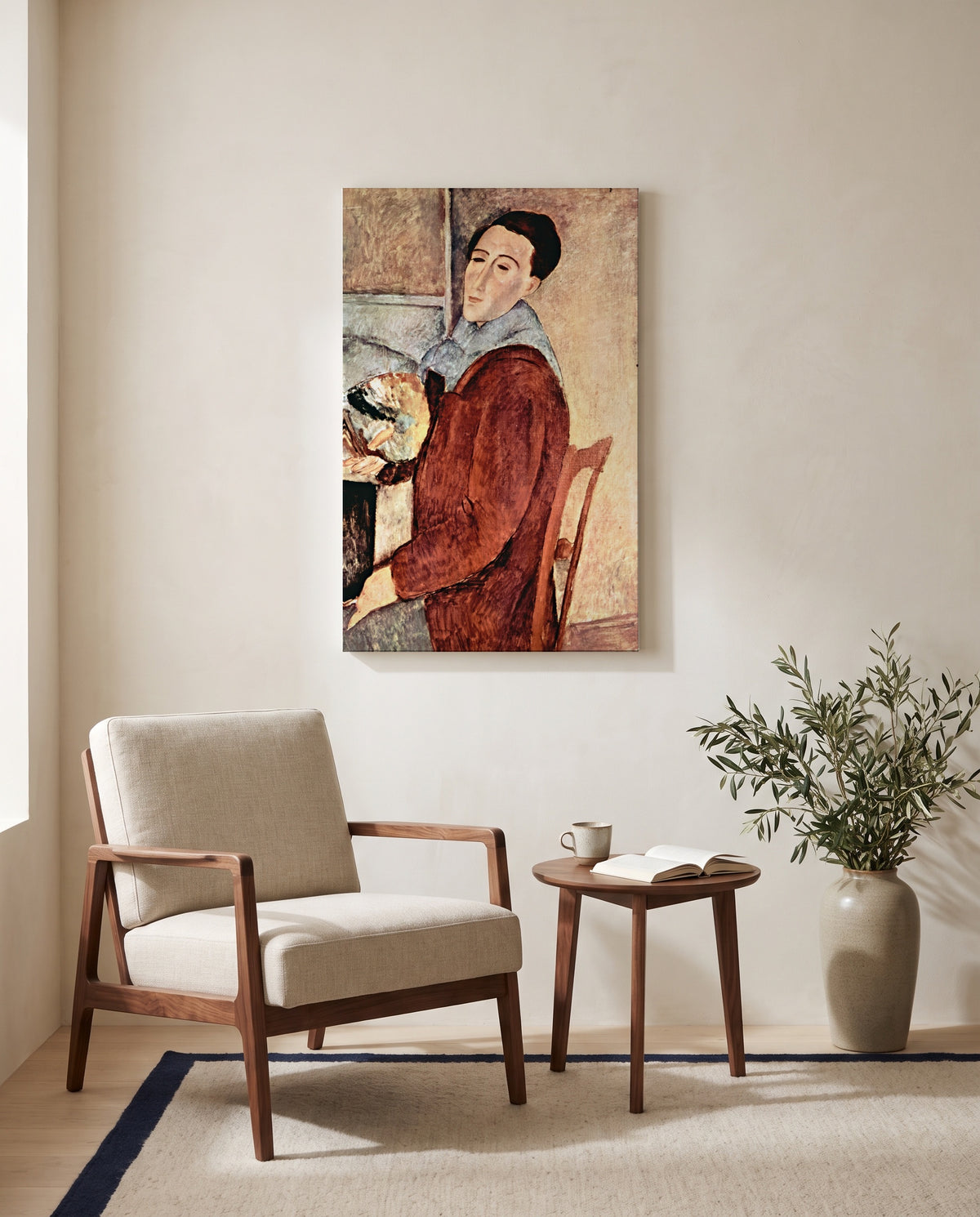 Self-Portrait by Amedeo Modigliani as a stretched canvas above a linen lounge chair in a reading corner
