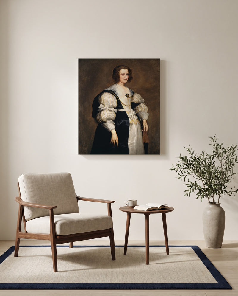 Lady with a Fan by Anthony van Dyck as a stretched canvas above a linen lounge chair in a reading corner