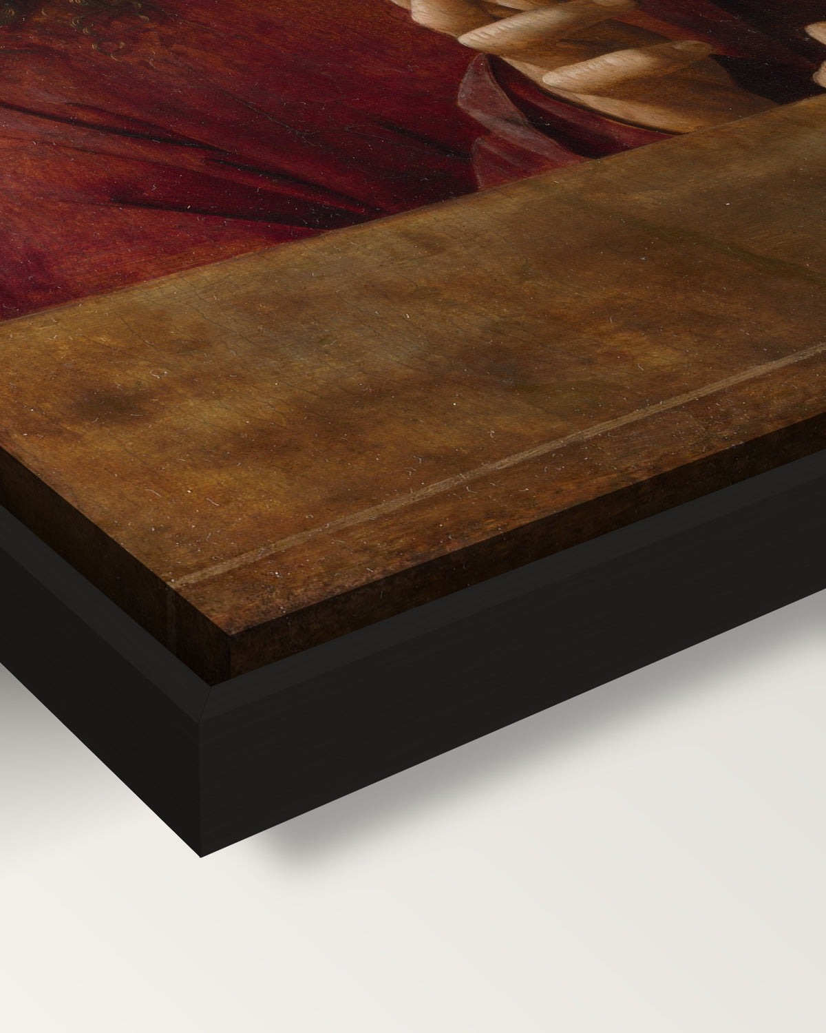Christ Blessing framed canvas, corner close-up: the canvas in a slim black floating frame, its painted edge in the shadow gap