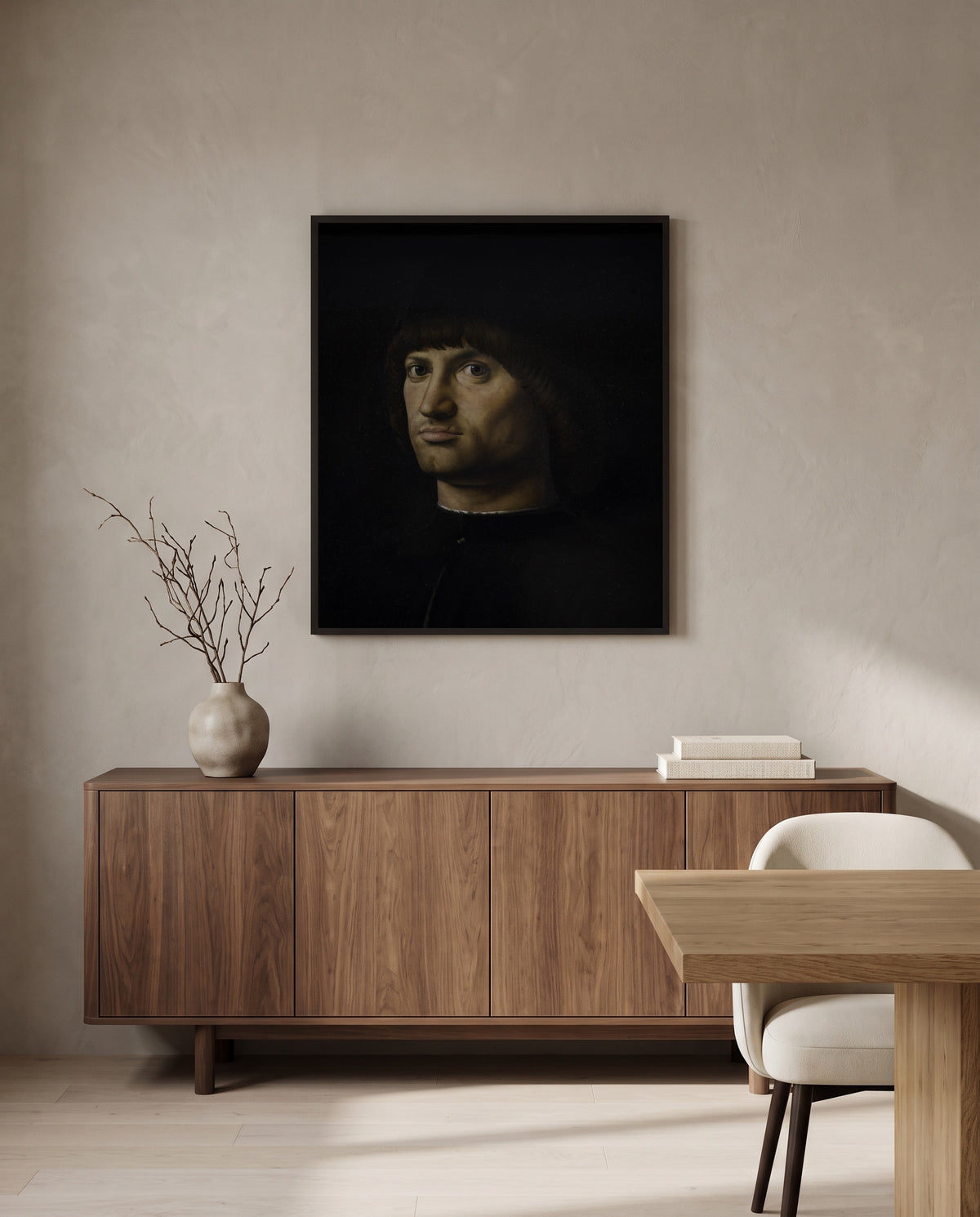 Il Condottiere by Antonello da Messina in a black frame above a walnut sideboard in a dining room