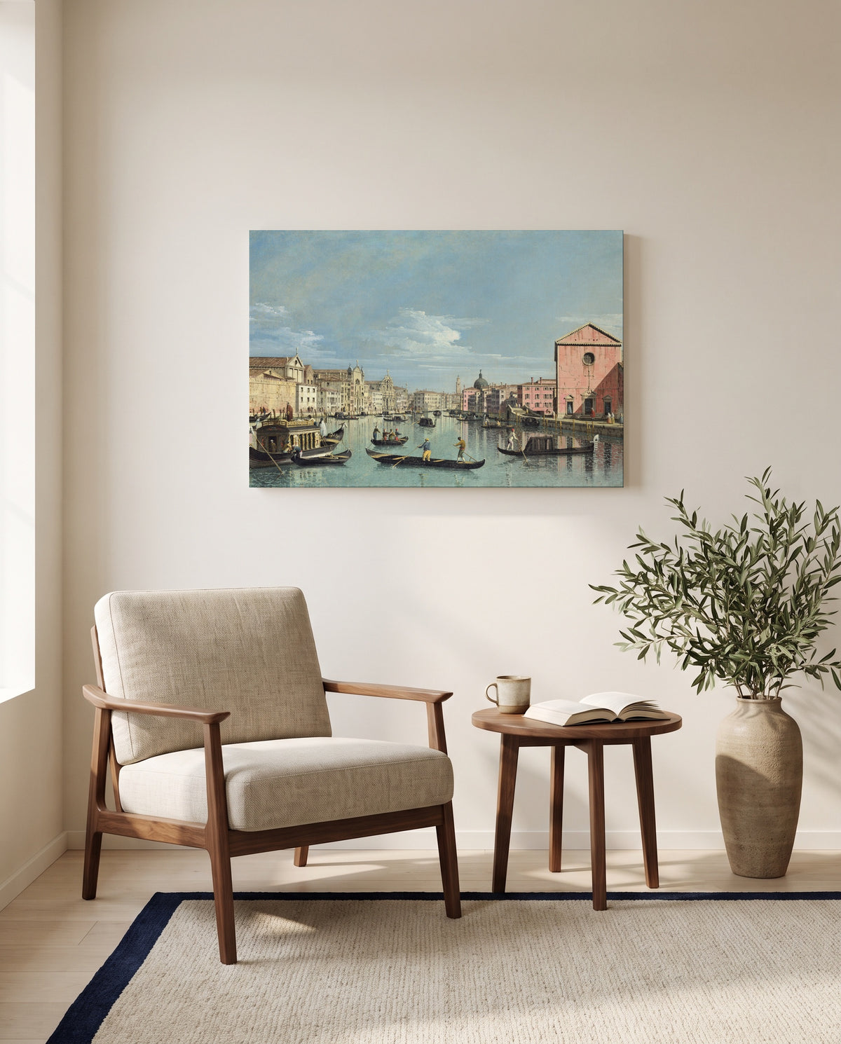 Grand Canal, Santa Croce by Bernardo Bellotto as a stretched canvas above a linen lounge chair in a reading corner