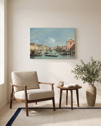 Grand Canal, Santa Croce by Bernardo Bellotto as a stretched canvas above a linen lounge chair in a reading corner