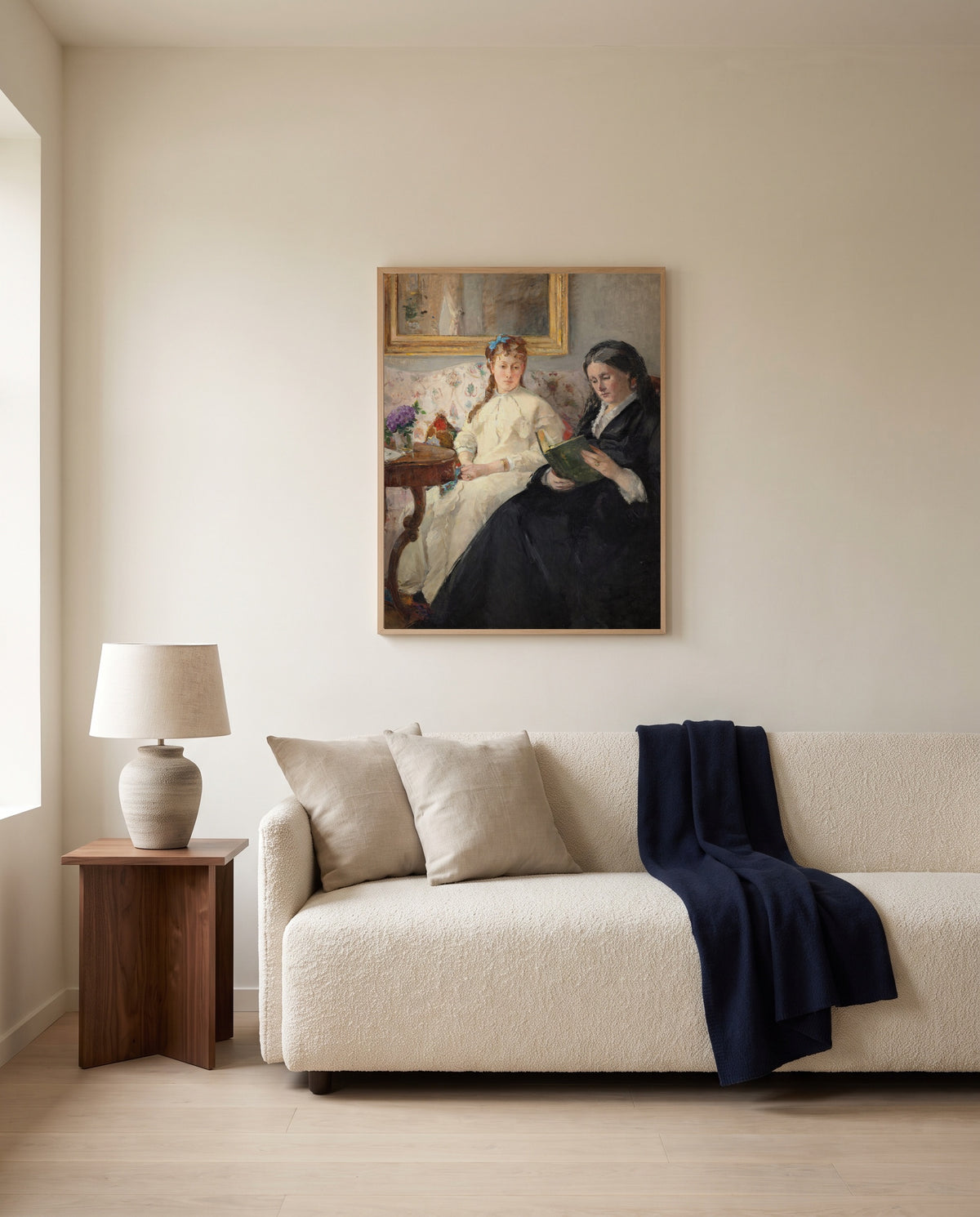 Mother and Sister by Berthe Morisot framed in natural oak above a cream sofa in a warm living room