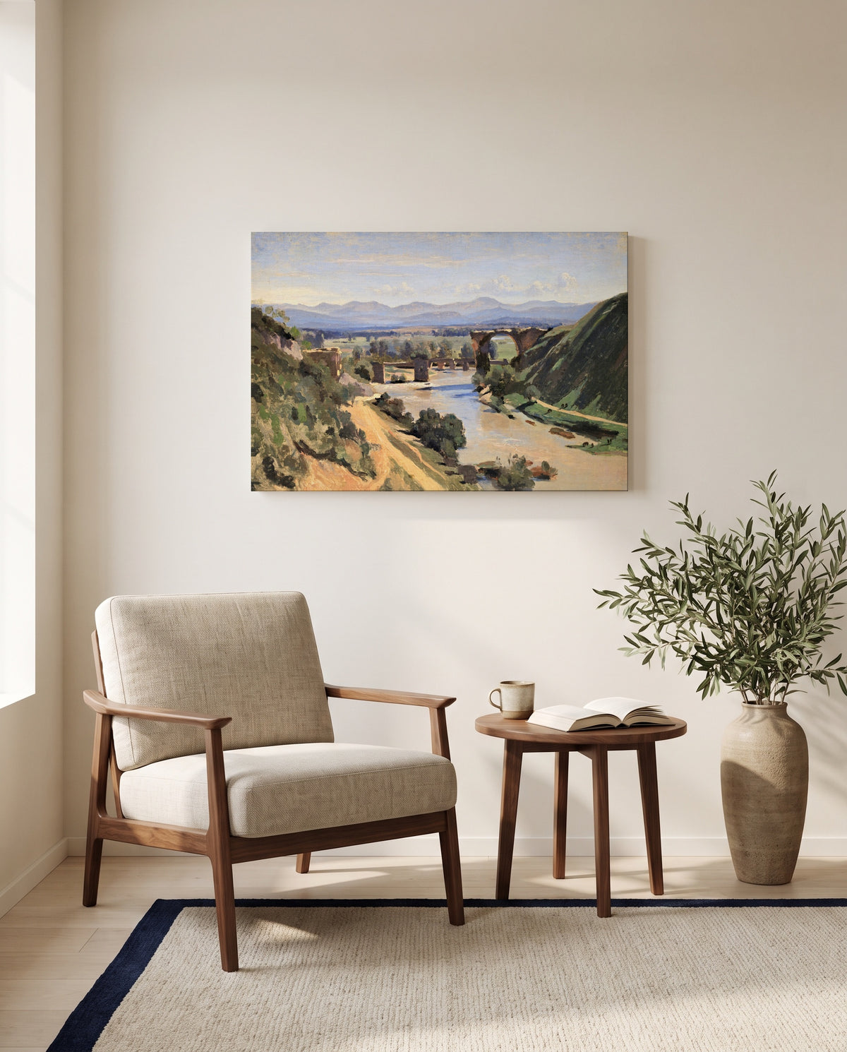The Bridge at Narni by Camille Corot as a stretched canvas above a linen lounge chair in a reading corner