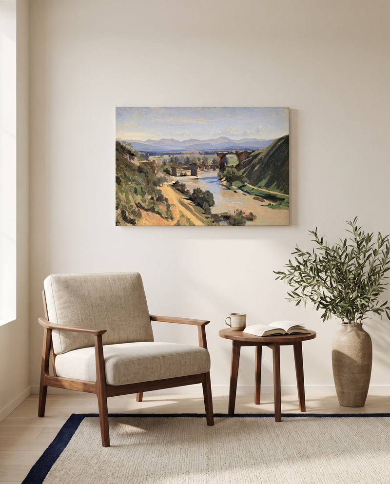 The Bridge at Narni by Camille Corot as a stretched canvas above a linen lounge chair in a reading corner