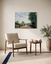 The Road from Sèvres by Camille Corot as a stretched canvas above a linen lounge chair in a reading corner