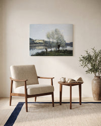Ville-d’Avray by Camille Corot as a stretched canvas above a linen lounge chair in a reading corner