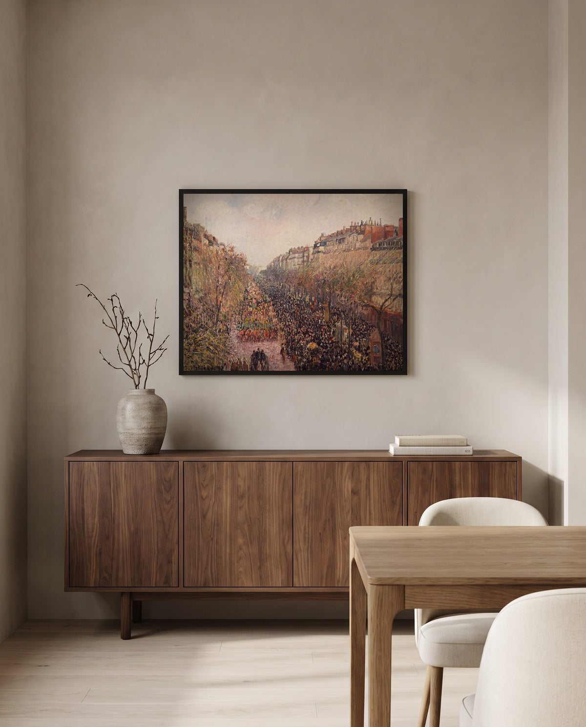 Boulevard Montmartre, Mardi Gras by Camille Pissarro in a black frame above a walnut sideboard in a dining room