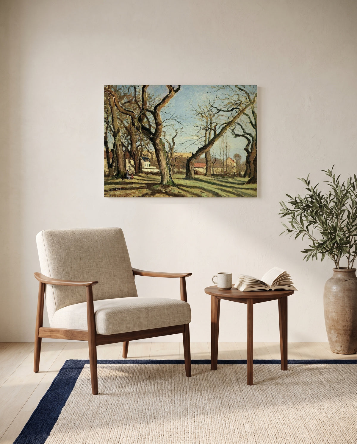 Chestnut Grove by Camille Pissarro as a stretched canvas above a linen lounge chair in a reading corner
