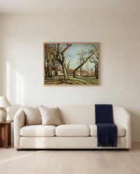 Chestnut Grove by Camille Pissarro framed in natural oak above a cream sofa in a warm living room