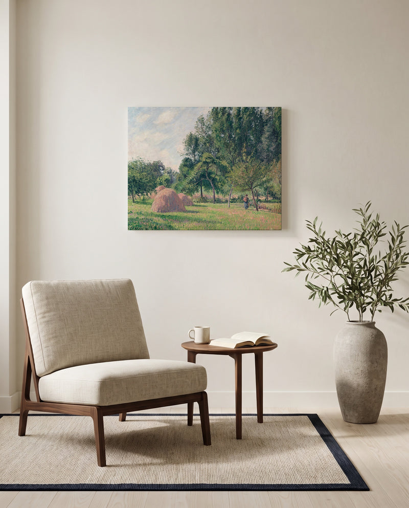 Haystacks, Morning by Camille Pissarro as a stretched canvas above a linen lounge chair in a reading corner
