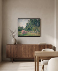 Haystacks, Morning by Camille Pissarro in a black frame above a walnut sideboard in a dining room