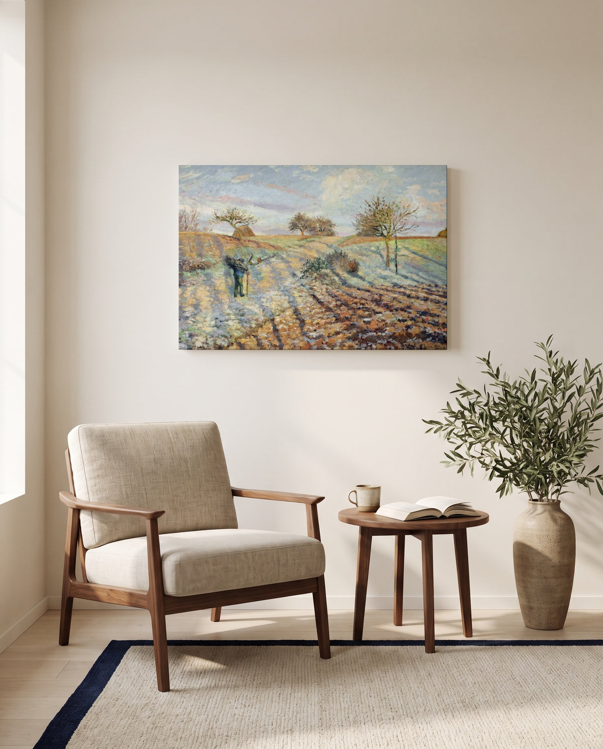 Hoarfrost by Camille Pissarro as a stretched canvas above a linen lounge chair in a reading corner