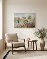 Hoarfrost by Camille Pissarro as a stretched canvas above a linen lounge chair in a reading corner