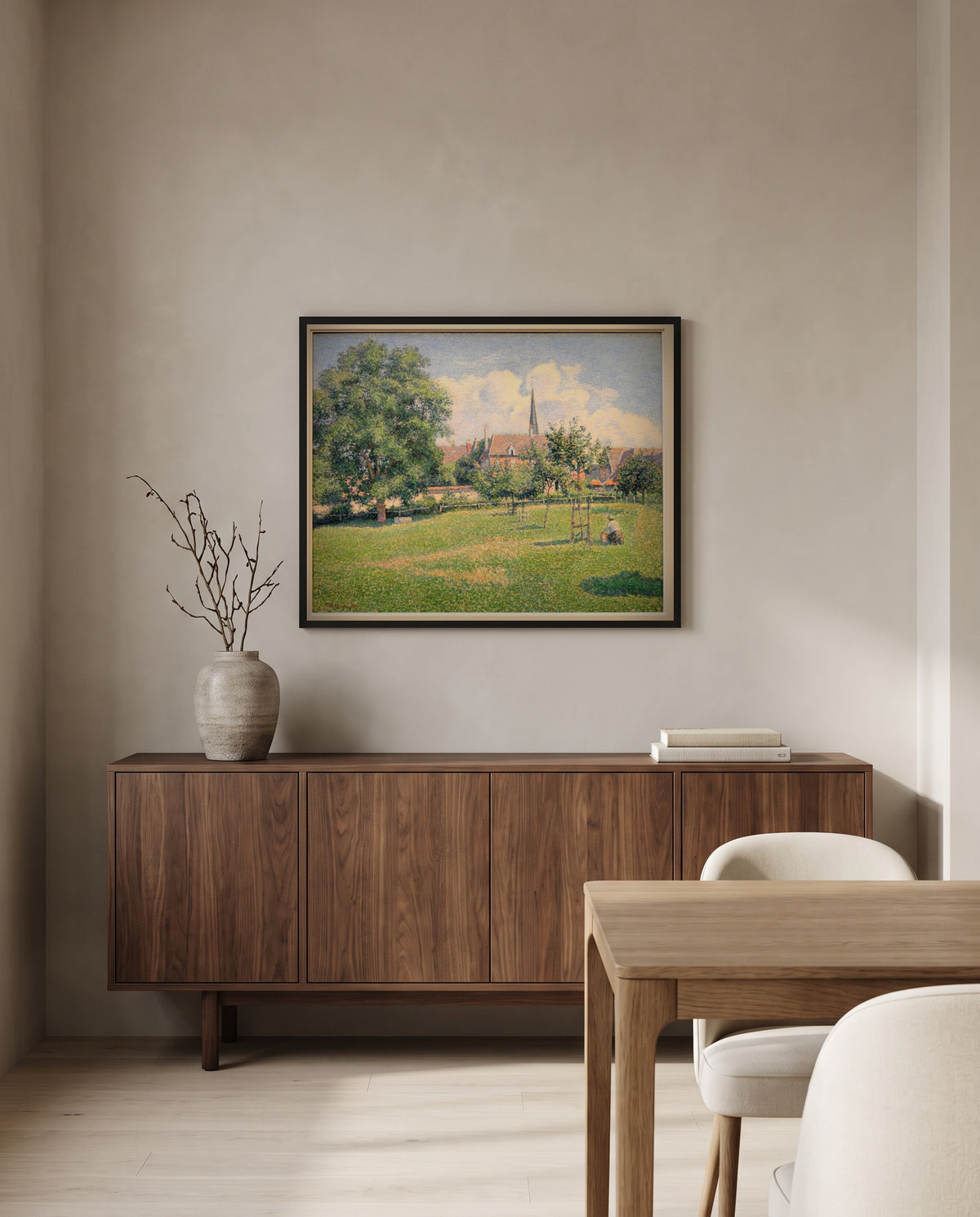 The House of the Deaf Woman by Camille Pissarro in a black frame above a walnut sideboard in a dining room