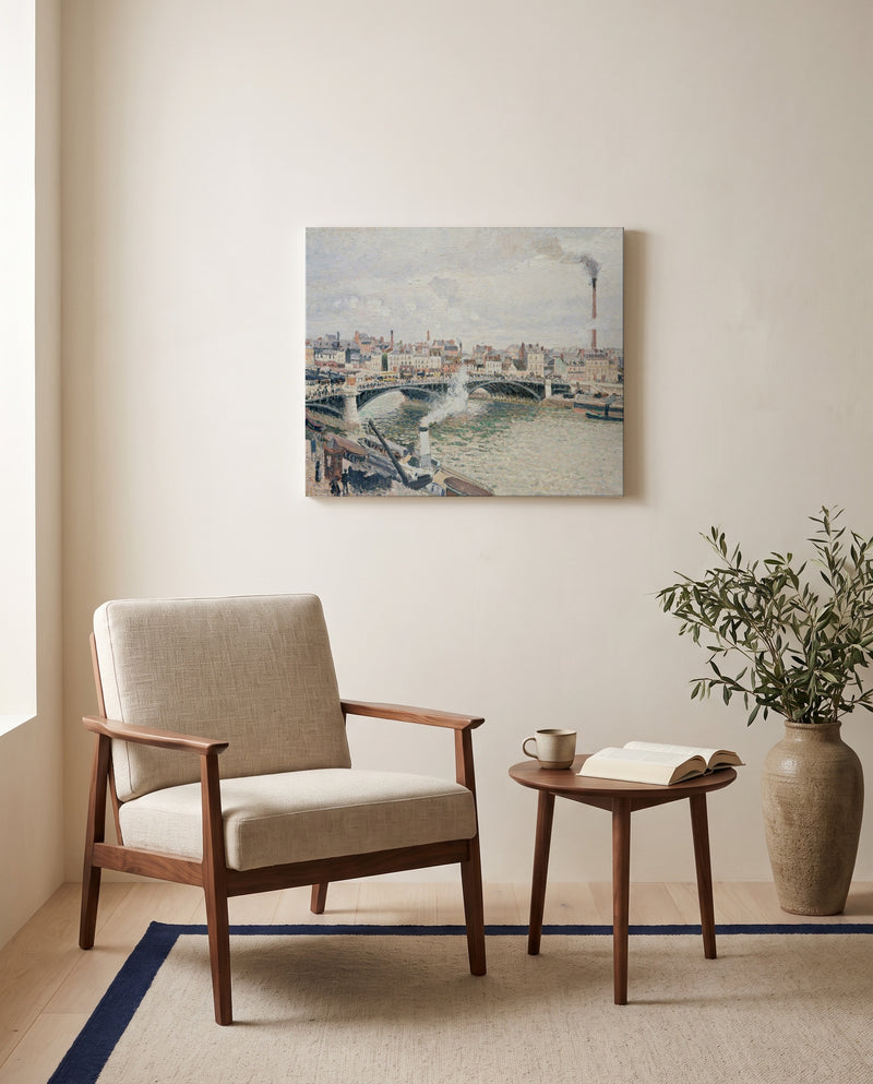 Overcast Day, Rouen by Camille Pissarro as a stretched canvas above a linen lounge chair in a reading corner
