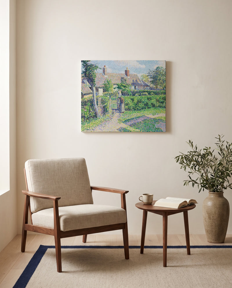 Peasants’ Houses, Éragny by Camille Pissarro as a stretched canvas above a linen lounge chair in a reading corner