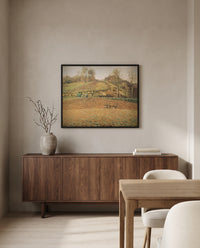 Ploughed Fields by Camille Pissarro in a black frame above a walnut sideboard in a dining room