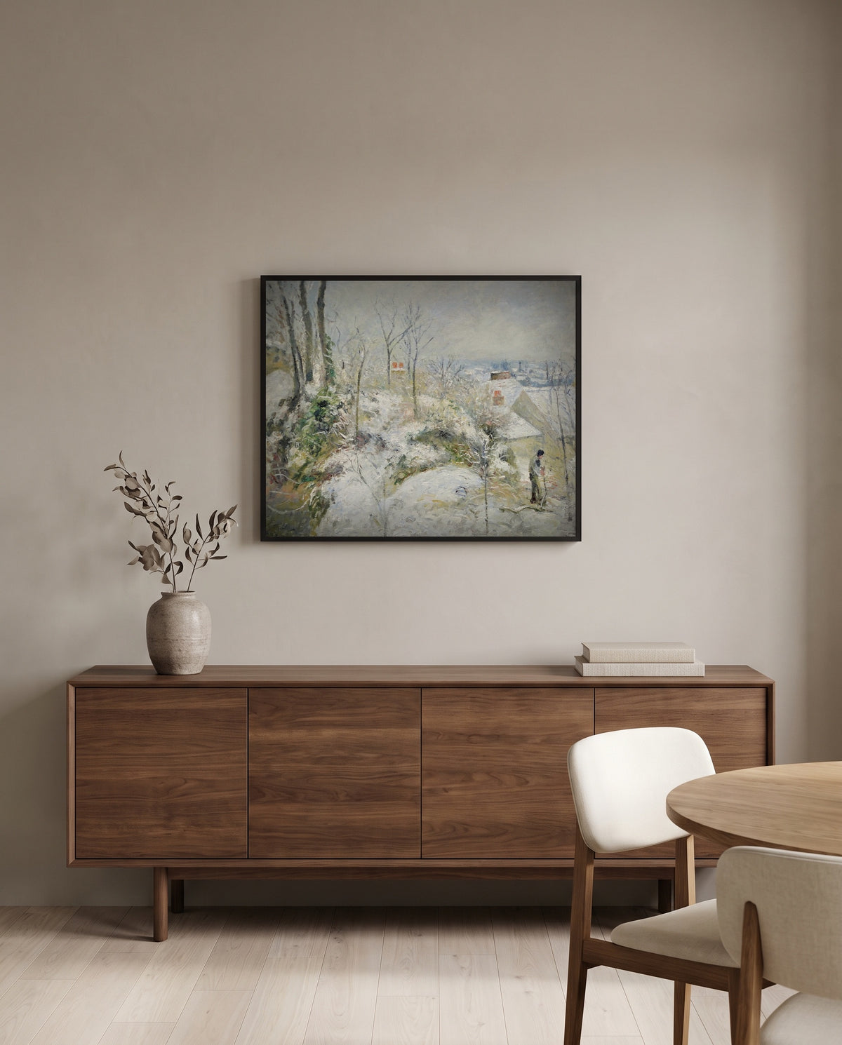 Rabbit Warren, Snow by Camille Pissarro in a black frame above a walnut sideboard in a dining room