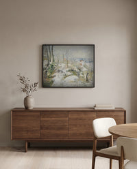Rabbit Warren, Snow by Camille Pissarro in a black frame above a walnut sideboard in a dining room