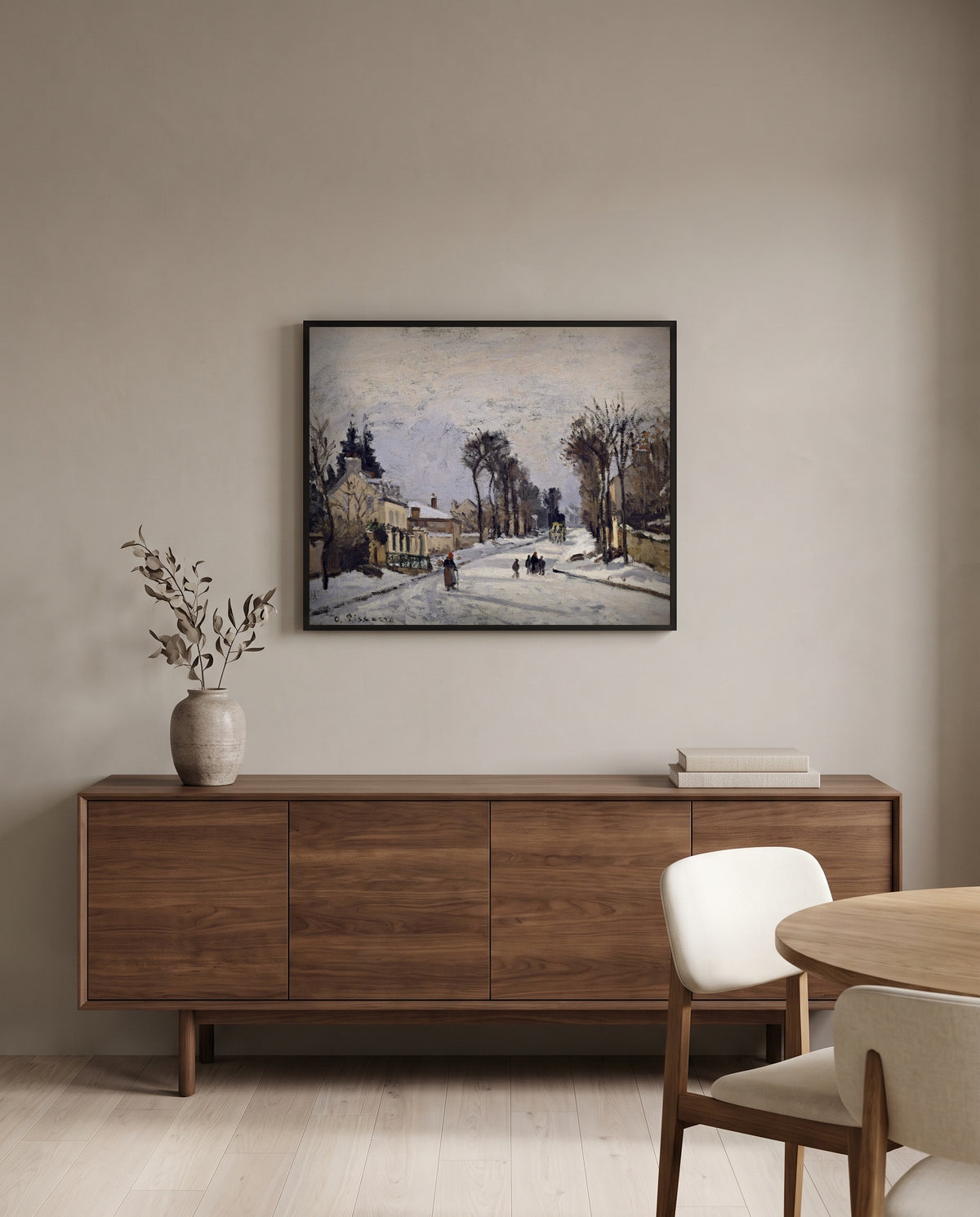 Route to Versailles by Camille Pissarro in a black frame above a walnut sideboard in a dining room