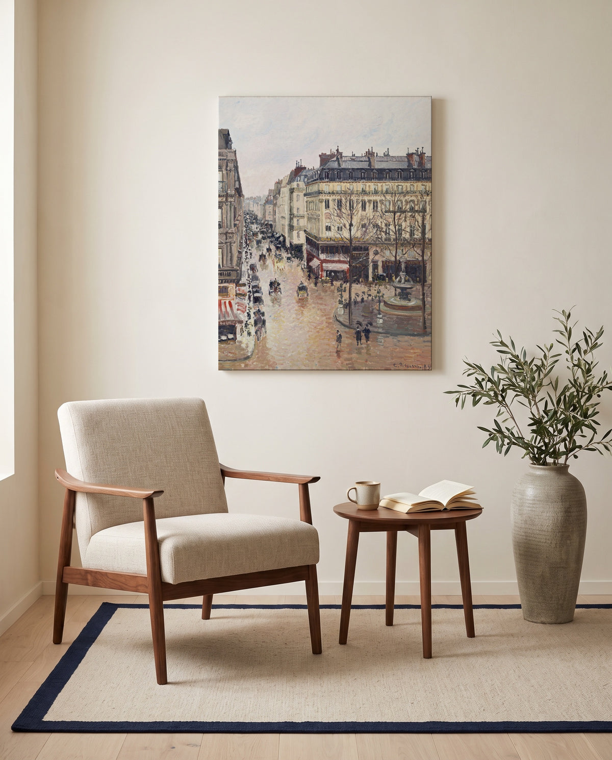 Rue Saint-Honoré, Effect of Rain by Camille Pissarro as a stretched canvas above a linen lounge chair in a reading corner