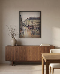 Rue Saint-Honoré, Effect of Rain by Camille Pissarro in a black frame above a walnut sideboard in a dining room