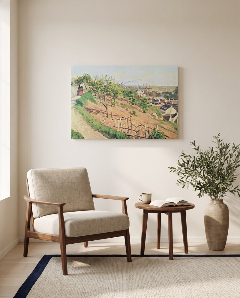 Ruelle des Poulies by Camille Pissarro as a stretched canvas above a linen lounge chair in a reading corner