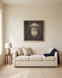 Self-Portrait by Camille Pissarro framed in natural oak above a cream sofa in a warm living room