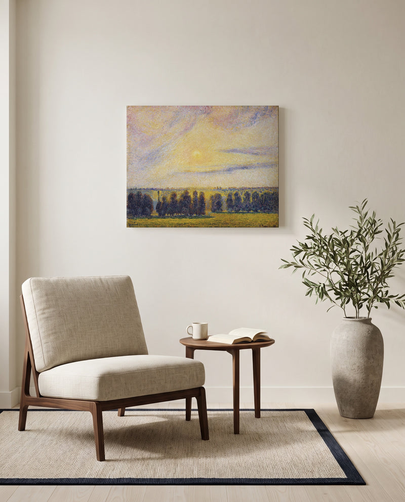 Sunset at Éragny by Camille Pissarro as a stretched canvas above a linen lounge chair in a reading corner