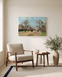 The Avenue, Sydenham by Camille Pissarro as a stretched canvas above a linen lounge chair in a reading corner