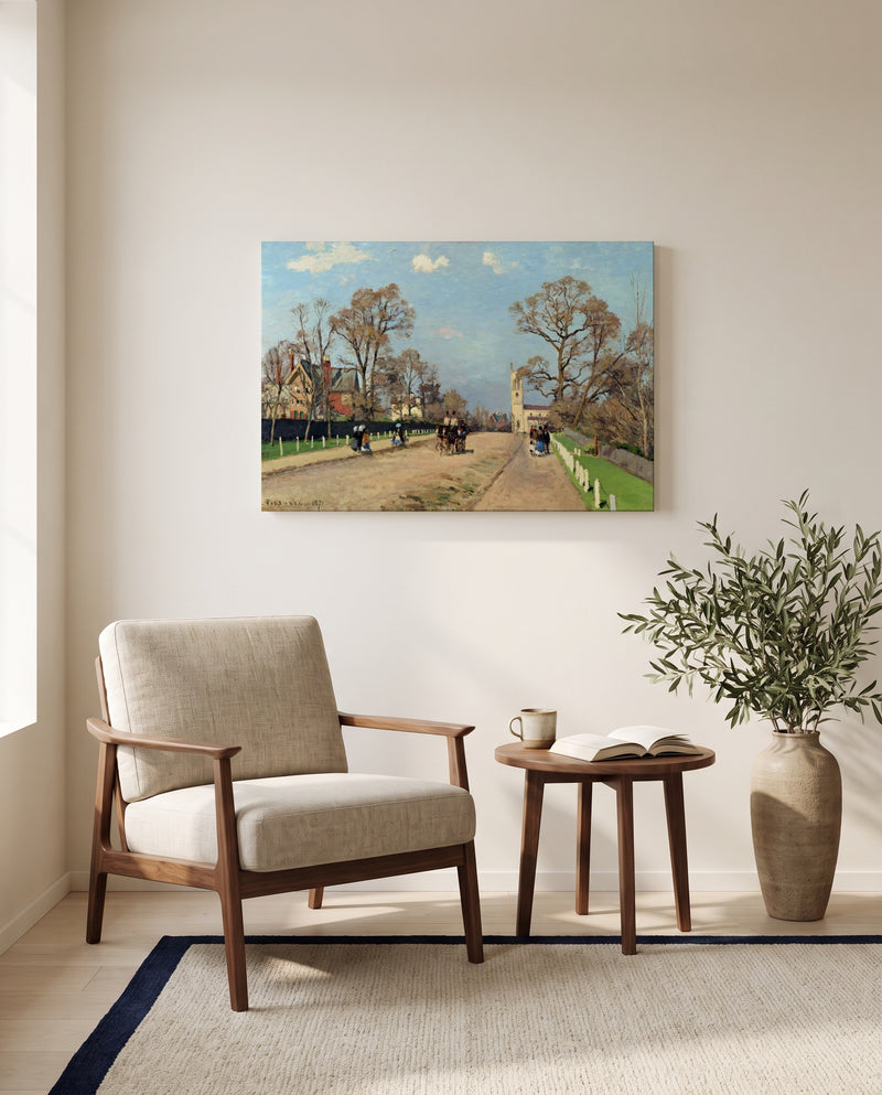 The Avenue, Sydenham by Camille Pissarro as a stretched canvas above a linen lounge chair in a reading corner